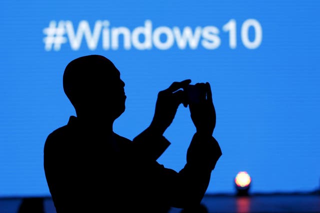 A Microsoft delegate takes a picture during the launch of the Windows 10 operating system in Kenya's capital Nairobi, July 29, 2015