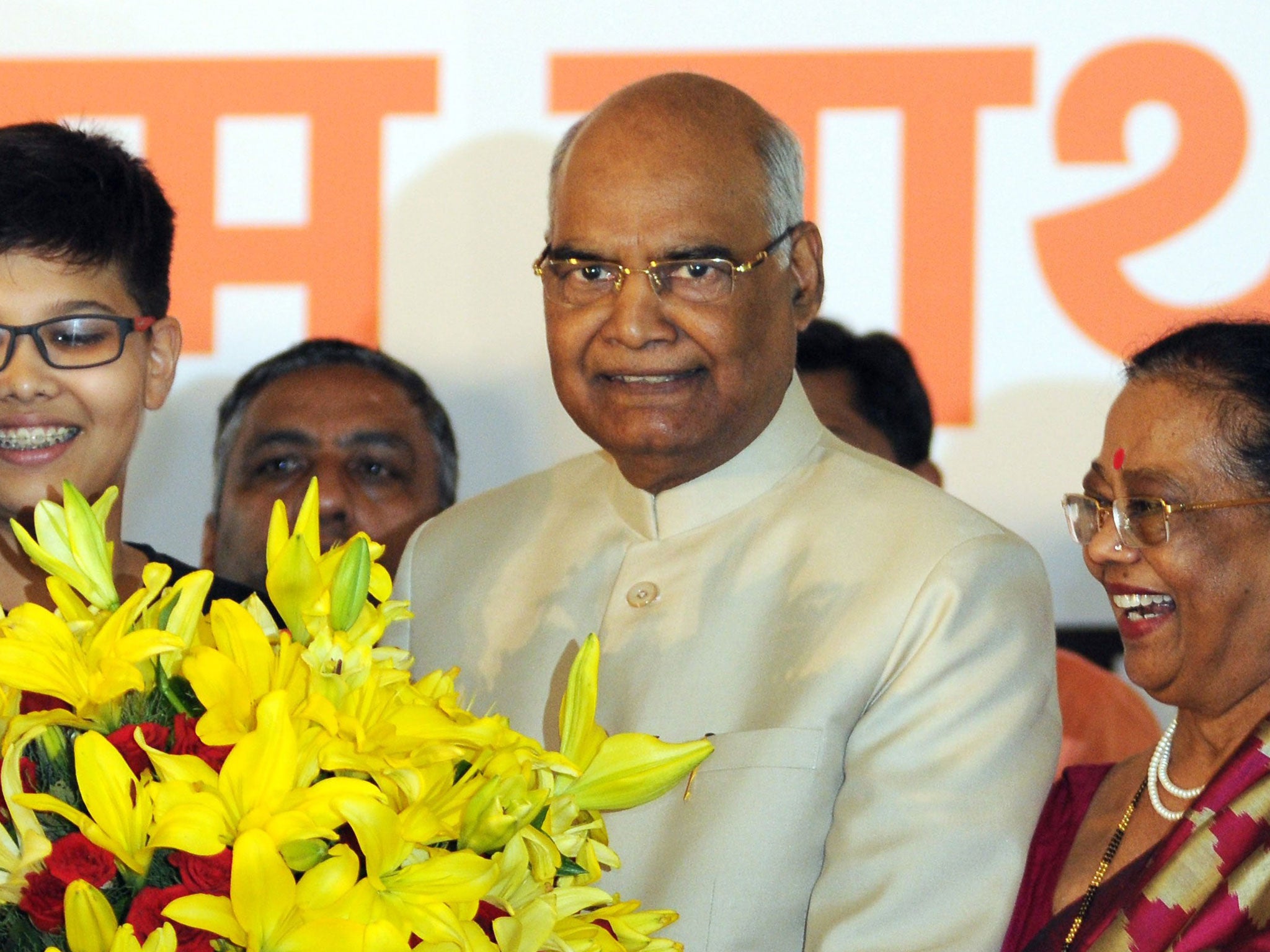 Newly elected President of India, Ram Nath Kovind, stands with his wife Kavita Kovind