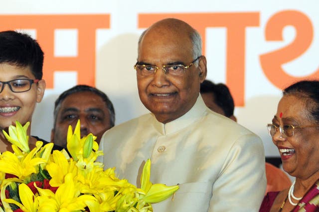Newly elected President of India, Ram Nath Kovind, stands with his wife Kavita Kovind