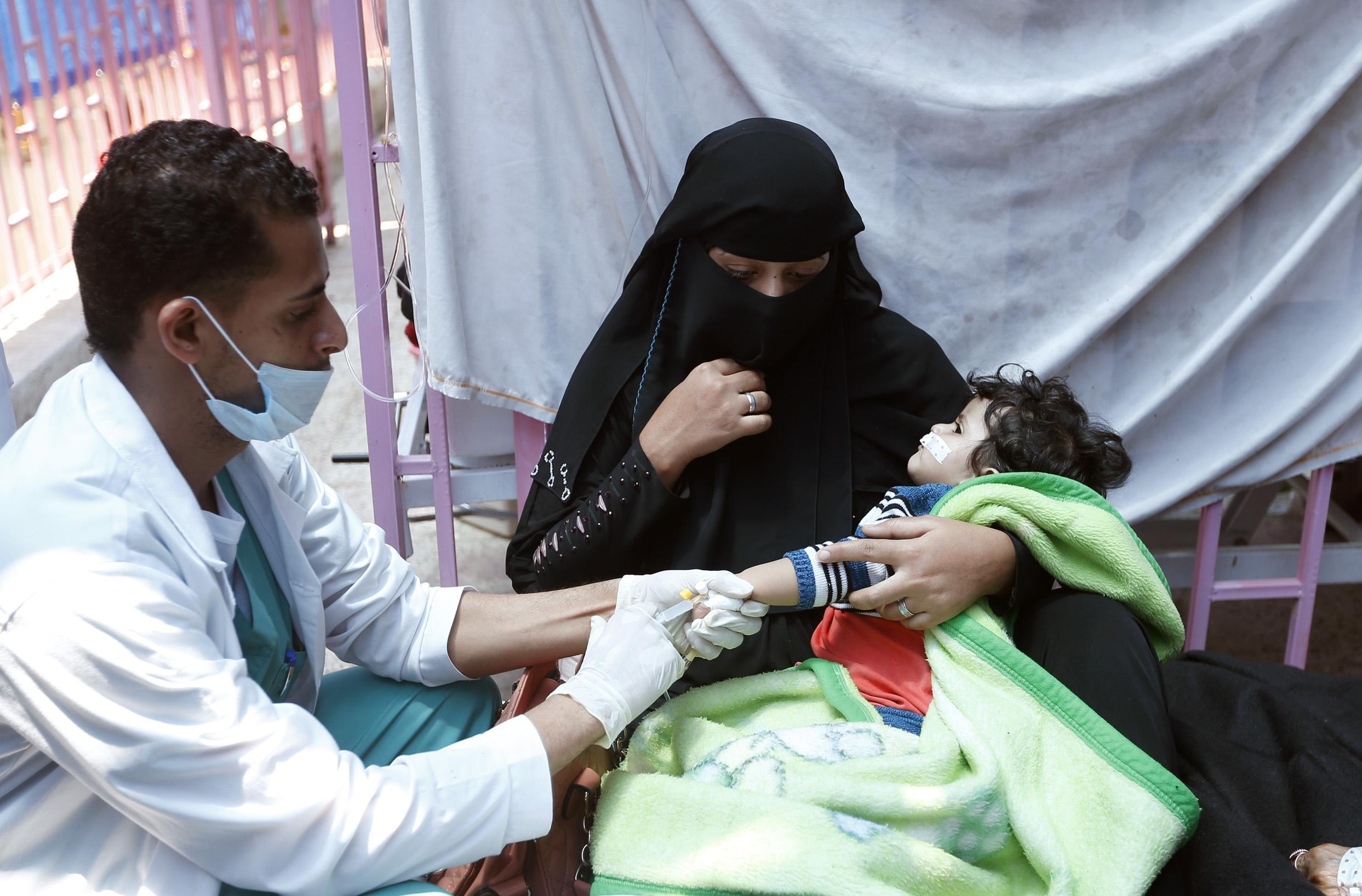 A child suspected of being infected with cholera receives treatment at a hospital in Sanaa on 6 May 2017. Around a quarter of the 2,000 people killed by the disease so far are children, the UN says