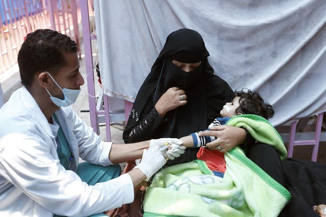 A child suspected of being infected with cholera receives treatment at a hospital in Sanaa on 6 May 2017. Around a quarter of the 2,000 people killed by the disease so far are children, the UN says