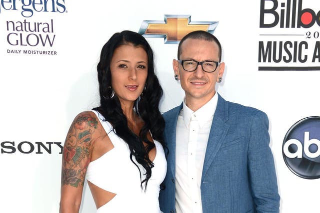 Chester Bennington of Linkin Park (R) and wife Talinda Ann Bentley (L) arrive at the 2012 Billboard Music Awards