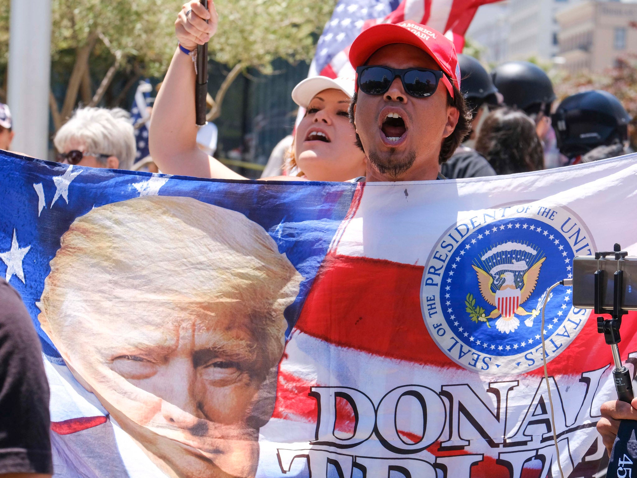 Donald Trump supporters demonstrating against anti-Trump protesters calling for the president's impeachment in Los Angeles