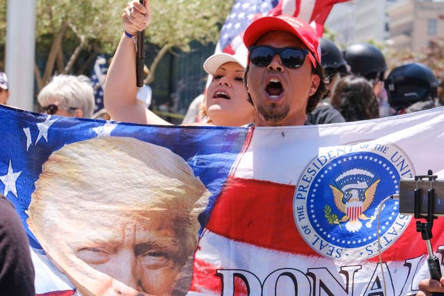 Donald Trump supporters demonstrating against anti-Trump protesters calling for the president's impeachment in Los Angeles