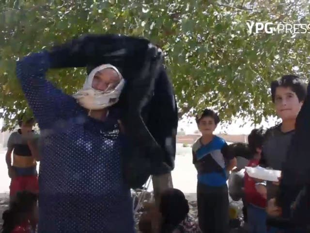 Syrian women are burning their burqas after being freed from the Isis stronghold in Raqqa