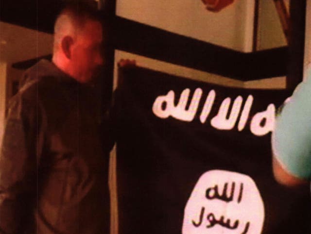 Ikaika Erik Kang is accused of holding an Isis flag while pledging allegiance to the militant group