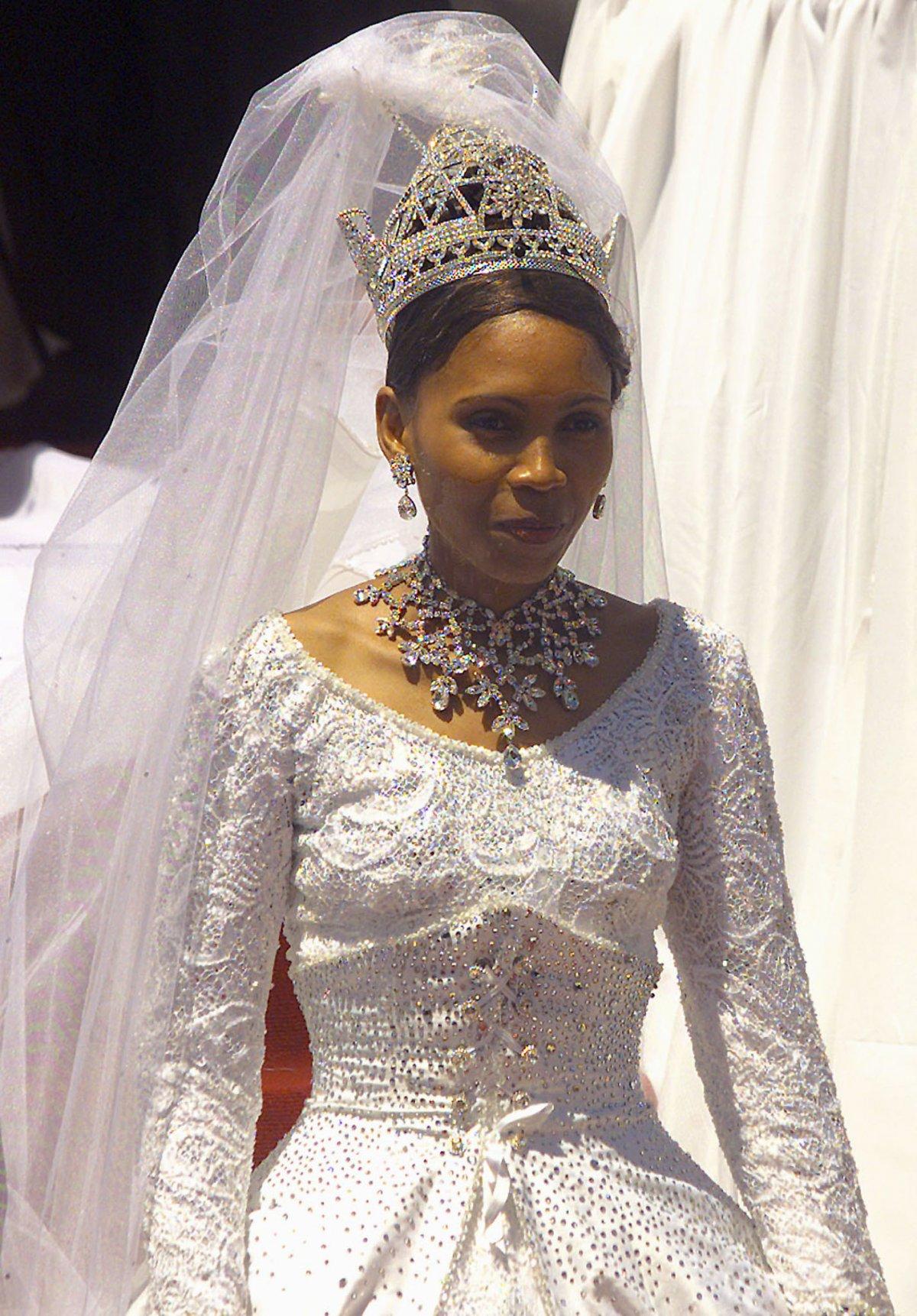 The 23-year-old wife of the Lesotho King Letsie III, Karabo Motsoeneng, leaves the Royal Wedding ceremony at the Lesotho Independent stadium in Maseru in 2000.