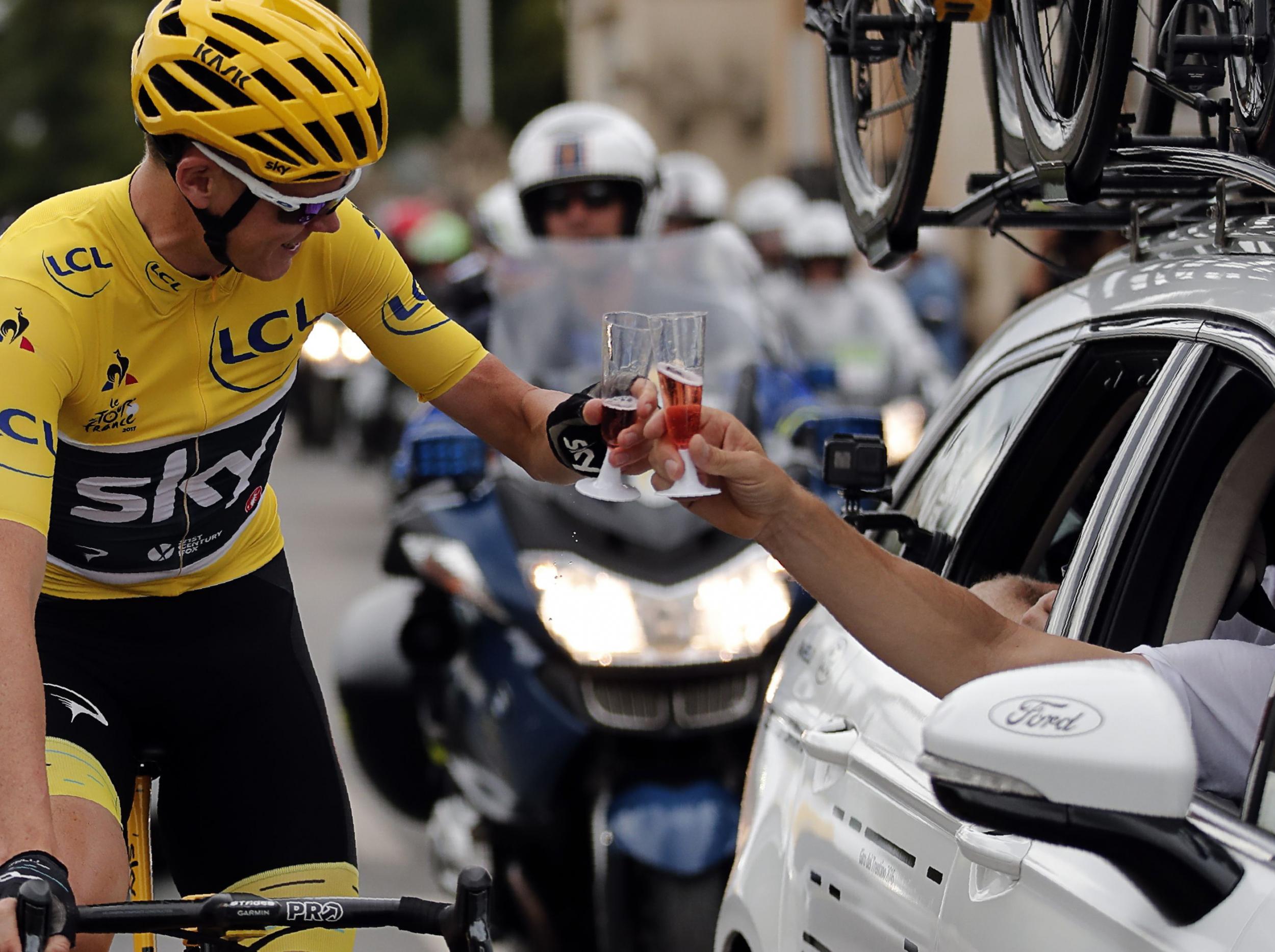 Froome was able to enjoy a glass of champagne during the final stage