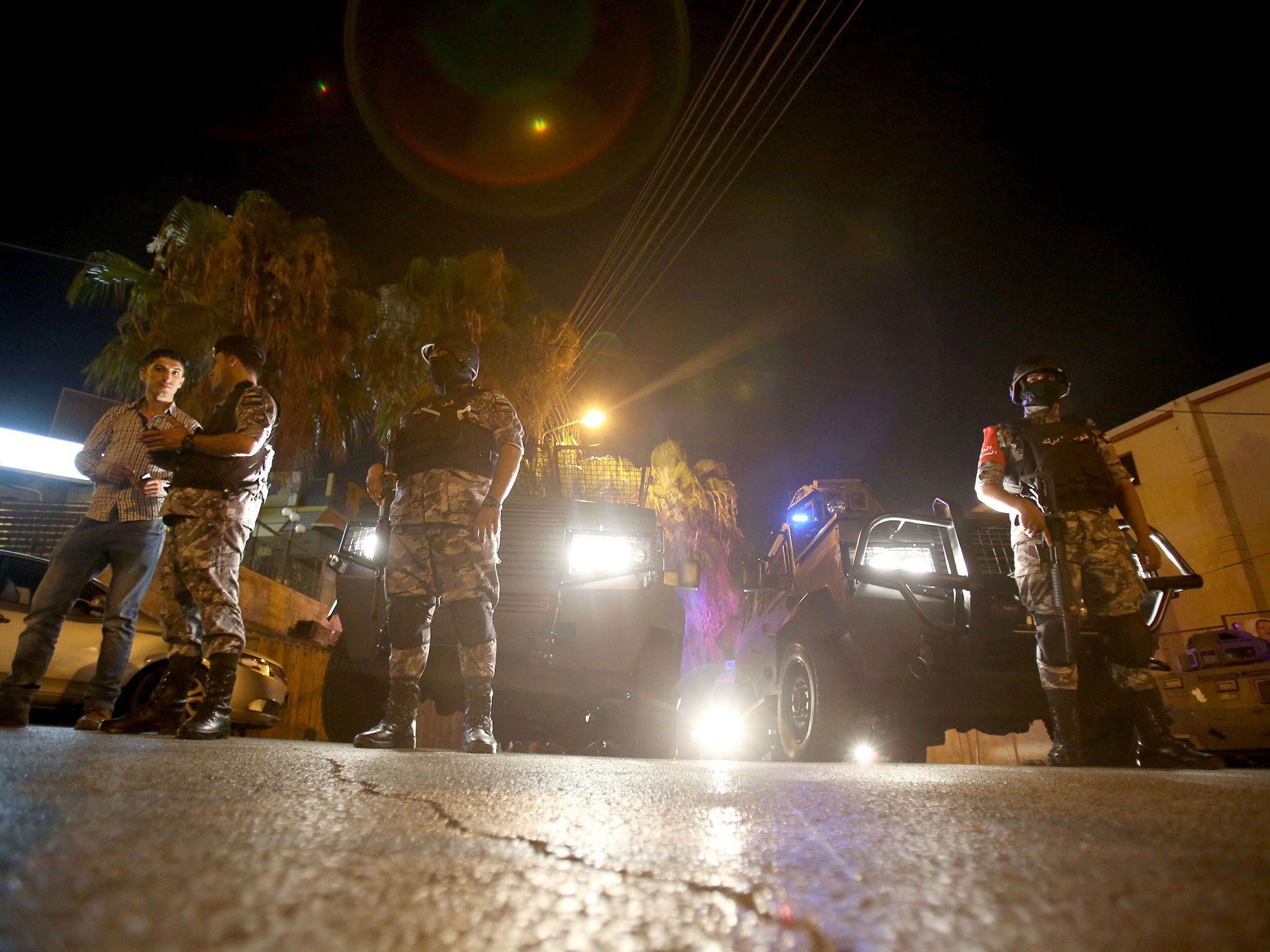 Security forces stand guard outside the Israeli embassy in the Rabiyeh neighbourhood of the Jordanian capital Amman following a security incident on 23 July 2017.