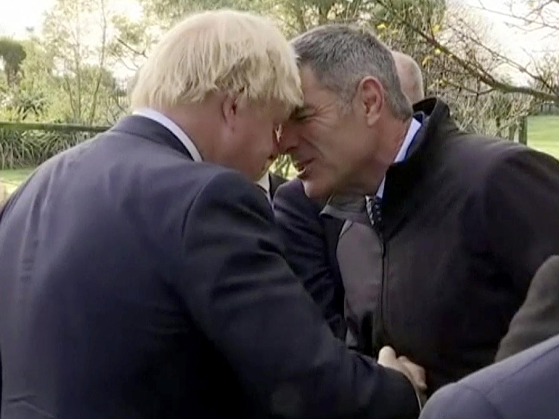 The Foreign Secretary performs a hongi with New Zealand industries minister Nathan Guy in Kaikoura on the South Island