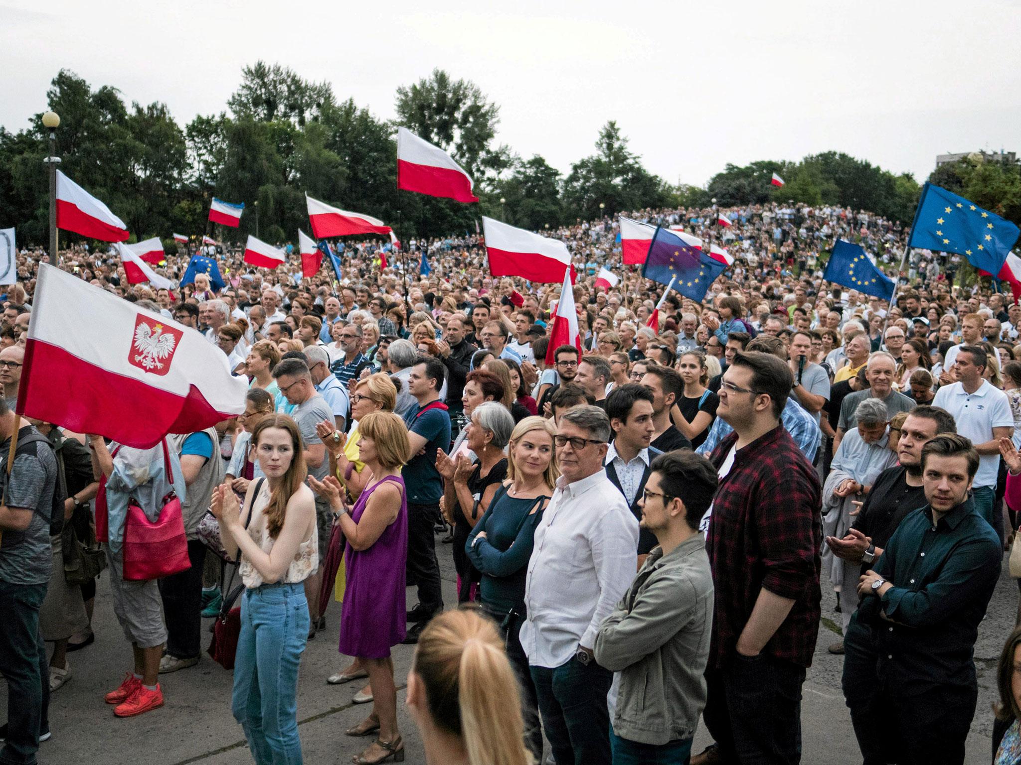 People gather during national protests against the Supreme Court legislation in Poznan, Poland (Agencja Gazeta/Lukasz Cynalewski via Reuters)