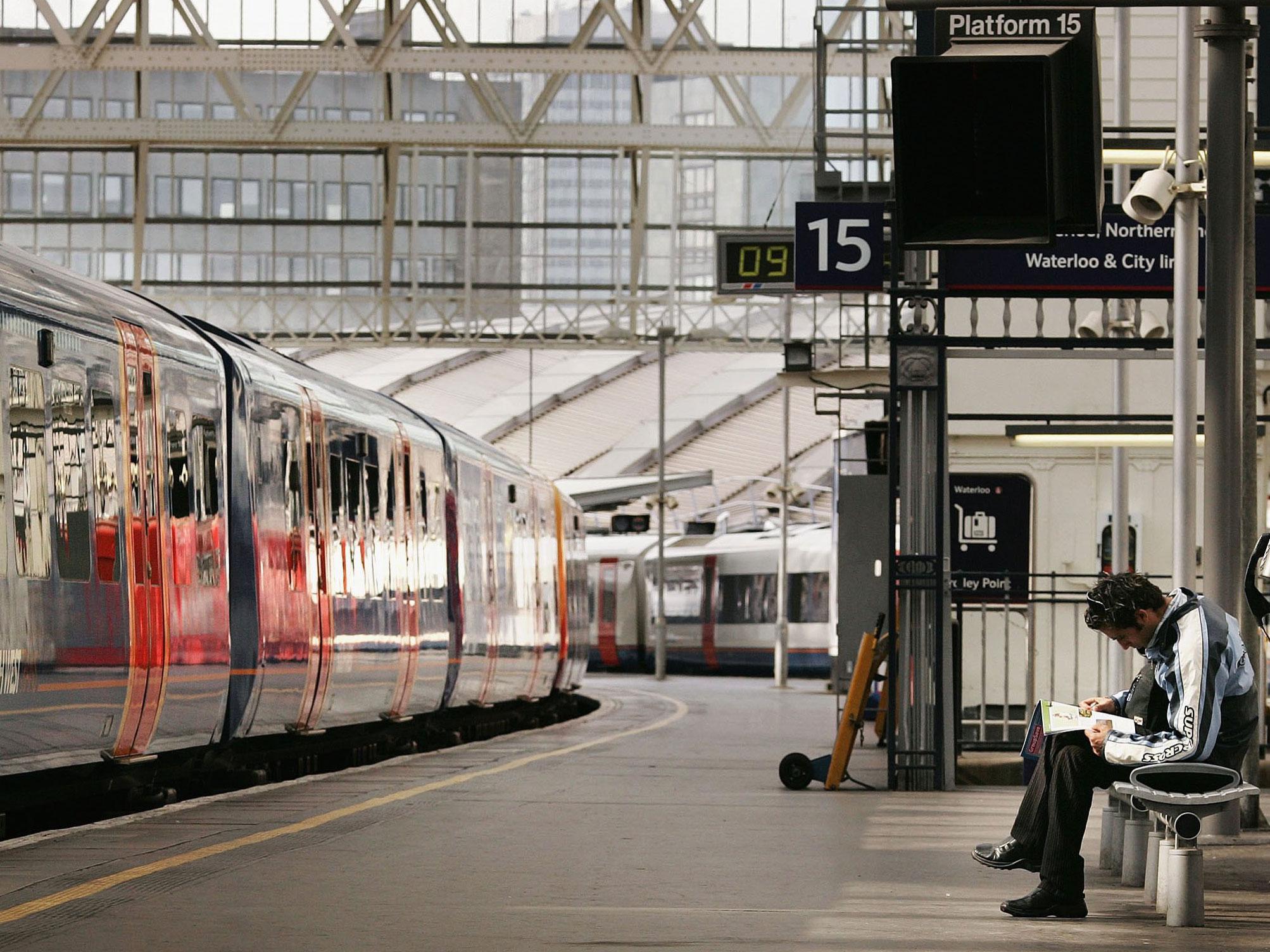 A passenger waits for a train to depart from Waterloo railway station