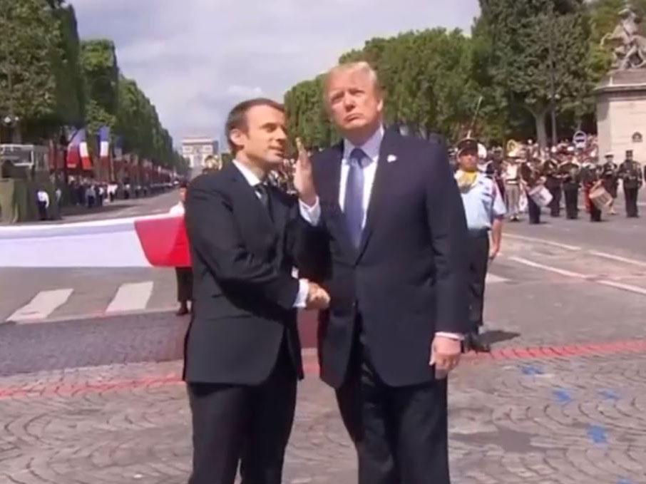 French President Emmanuel Macron shaking hands with US President Donald Trump during Bastille Day celebrations