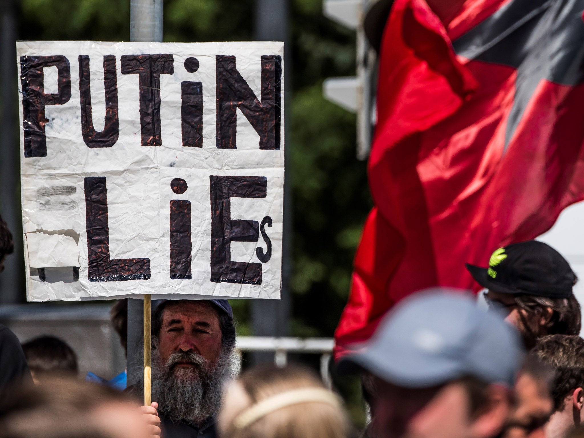 A protester holding a sign at the protest in Moscow. It is not known if this is Grigory Sakonov