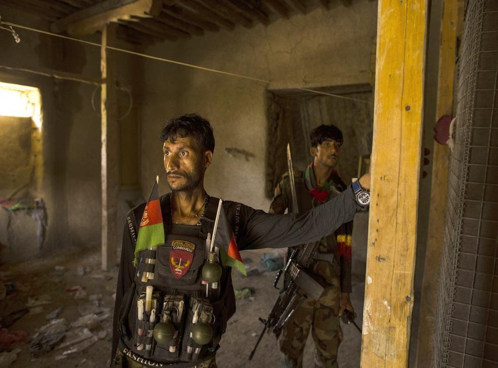 Afghan commandos man a checkpoint in Afghanistan’s Momand Valley. The building was captured from the Islamic State in Khorasan, which used it as a prison and court