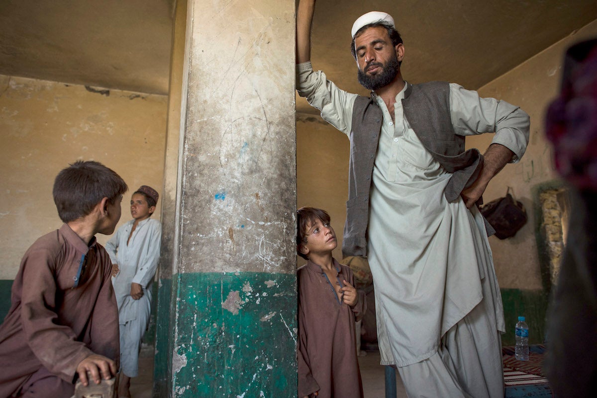 Mir Jamar and his family are living in an abandoned hotel since fleeing their village in Afghanistan’s Achin district