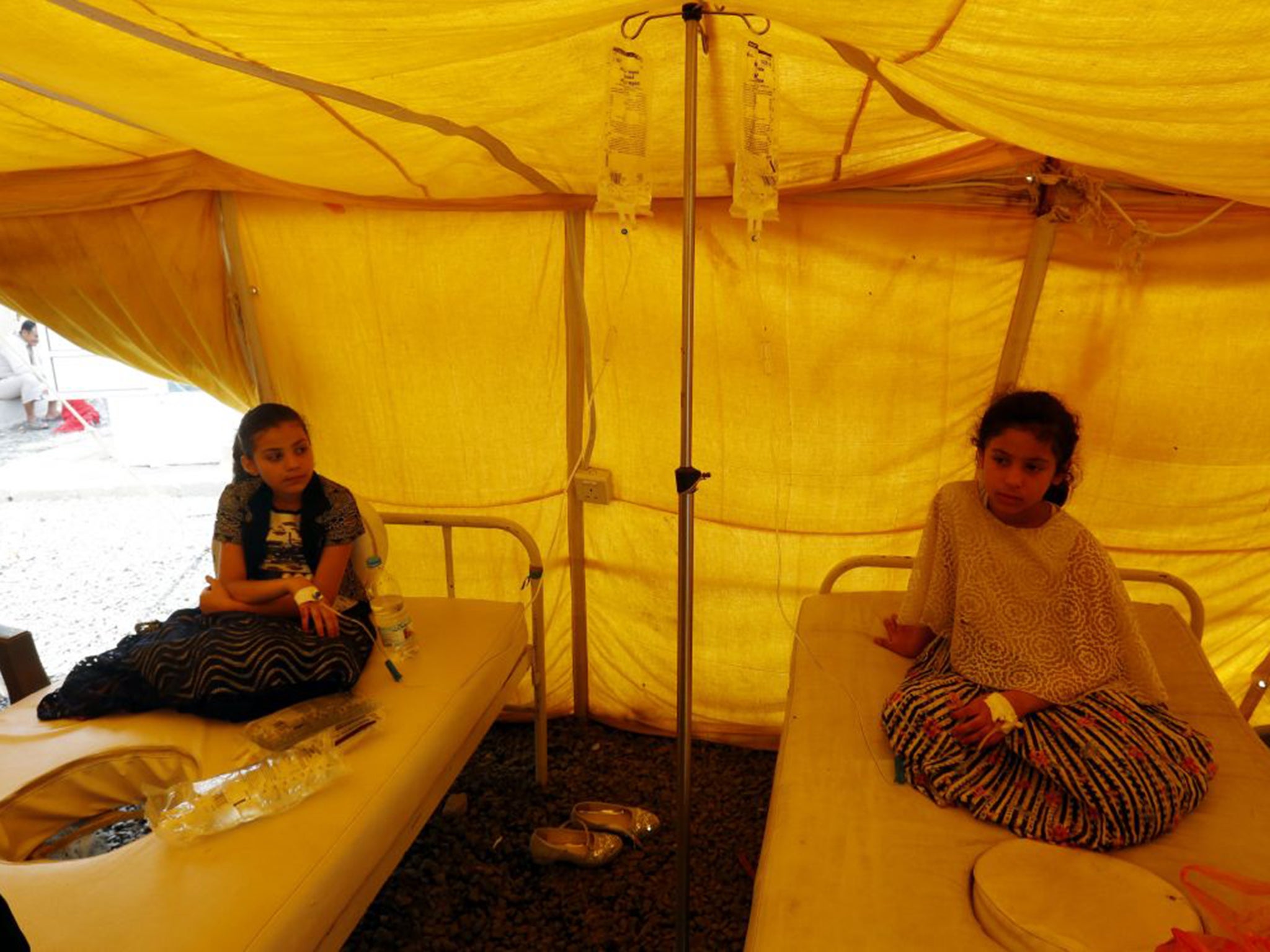 Children receive treatment for Cholera inside a makeshift hospital in Sanaa