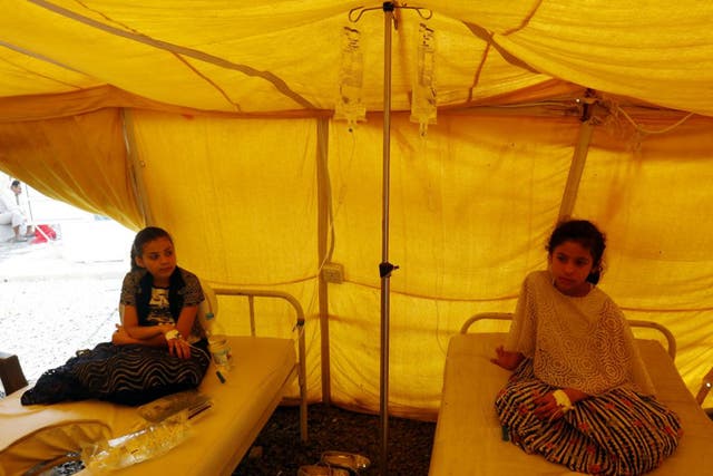 Children receive treatment for Cholera inside a makeshift hospital in Sanaa