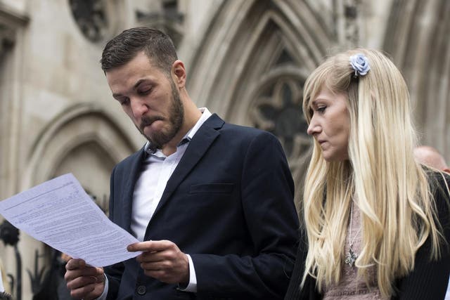 Charlie Gard's parents, Chris Gard (L) Connie Yates (R), deliver a statement outside the High Court