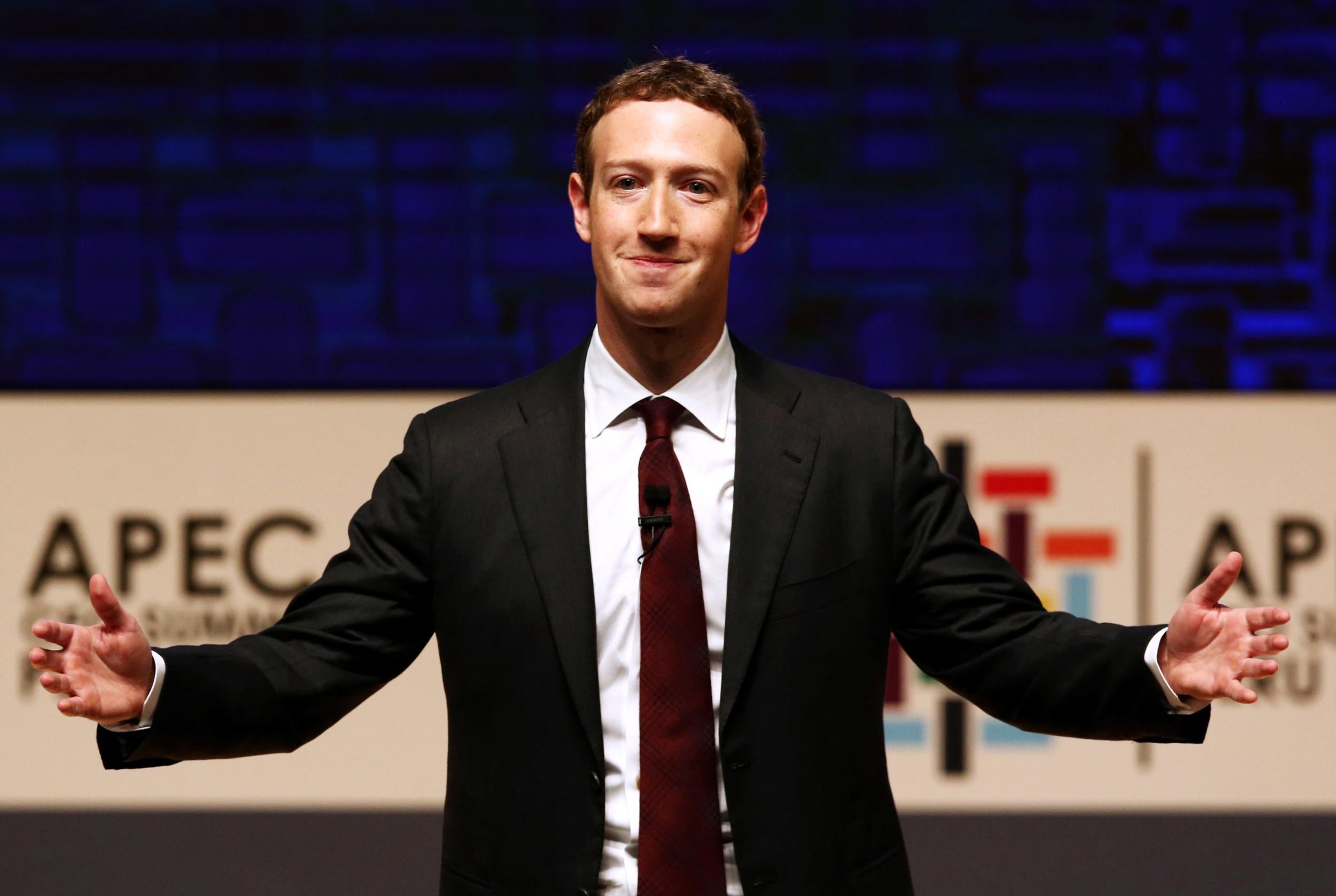 Mark Zuckerberg gestures while addressing the audience during a meeting of the APEC (Asia-Pacific Economic Cooperation) CEO Summit in Lima, Peru, November 19, 2016