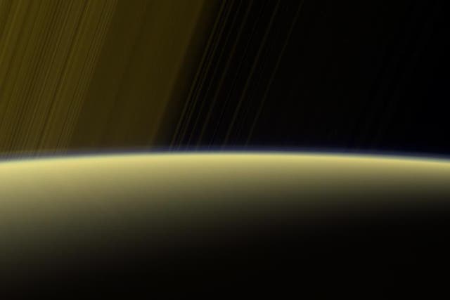 This false-color view from NASA's Cassini spacecraft gazes toward the rings beyond Saturn's sunlit horizon. Along the limb (the planet's edge) at left can be seen a thin, detached haze. This haze vanishes toward the left side of the scene.