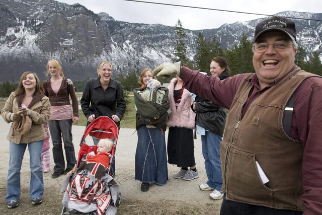 Winston Blackmore, leader of the controversial polygamous religious community of Bountiful based near Creston, British Columbia, pictured with six of his daughters and two of his grandchildren in 2008