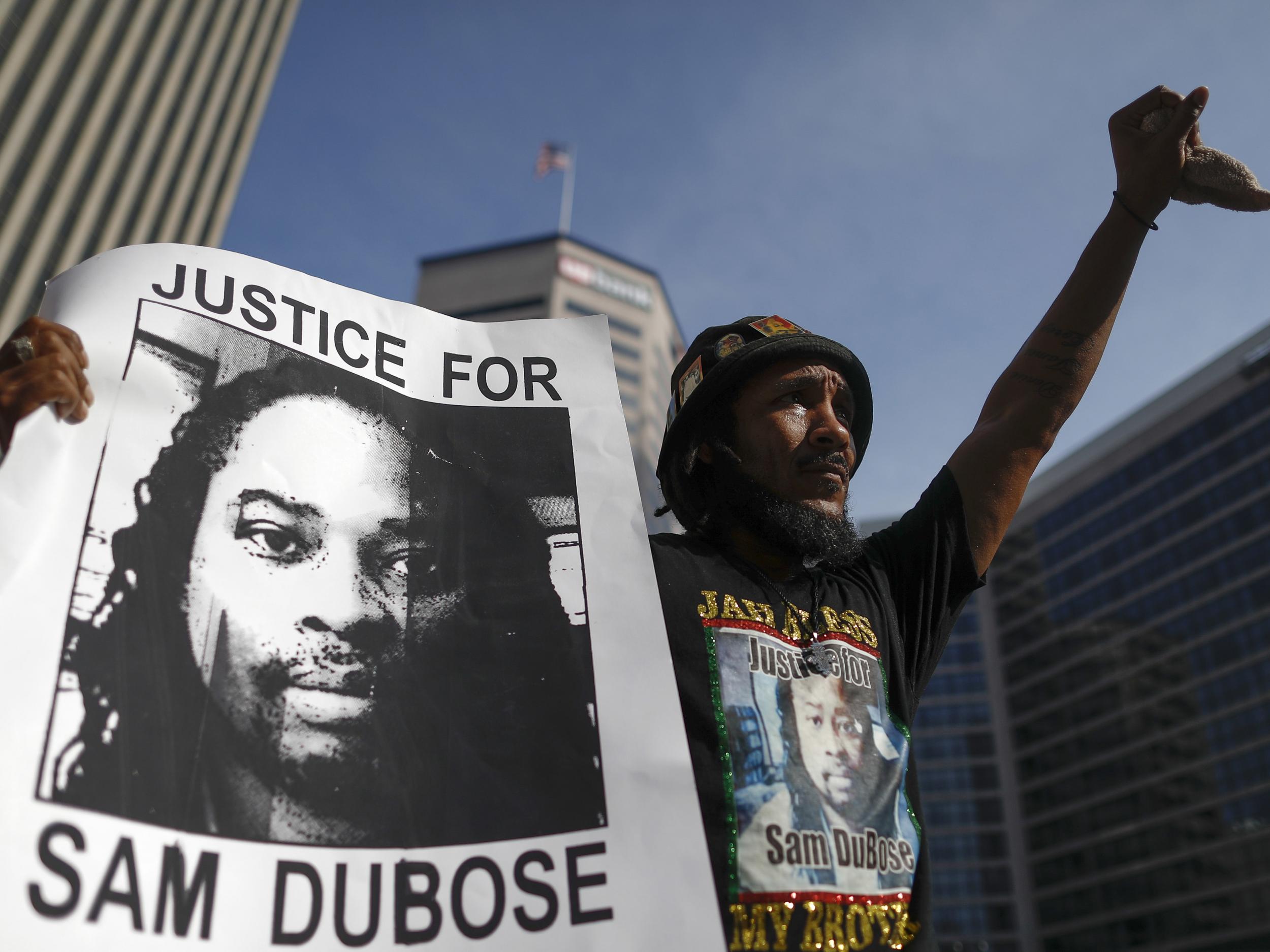 A protester raises his fist during a demonstration demanding former University of Cincinnati police officer Ray Tensing be retried for murder in the shooting death of motorist Sam DuBose on 22 July