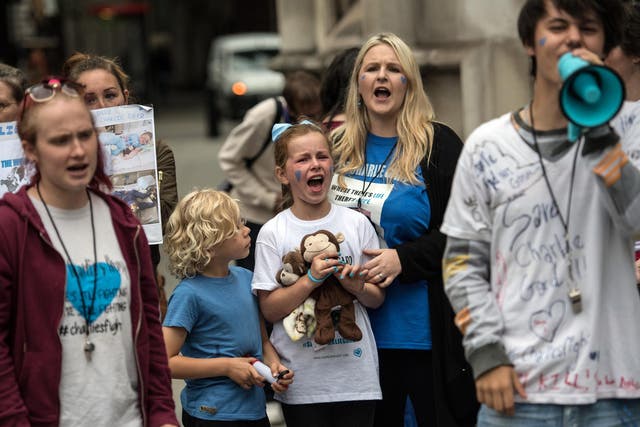 Campaigners outside the High Court where the terminally ill baby’s gave an emotional statement after ending their legal fight for an experimental treatment