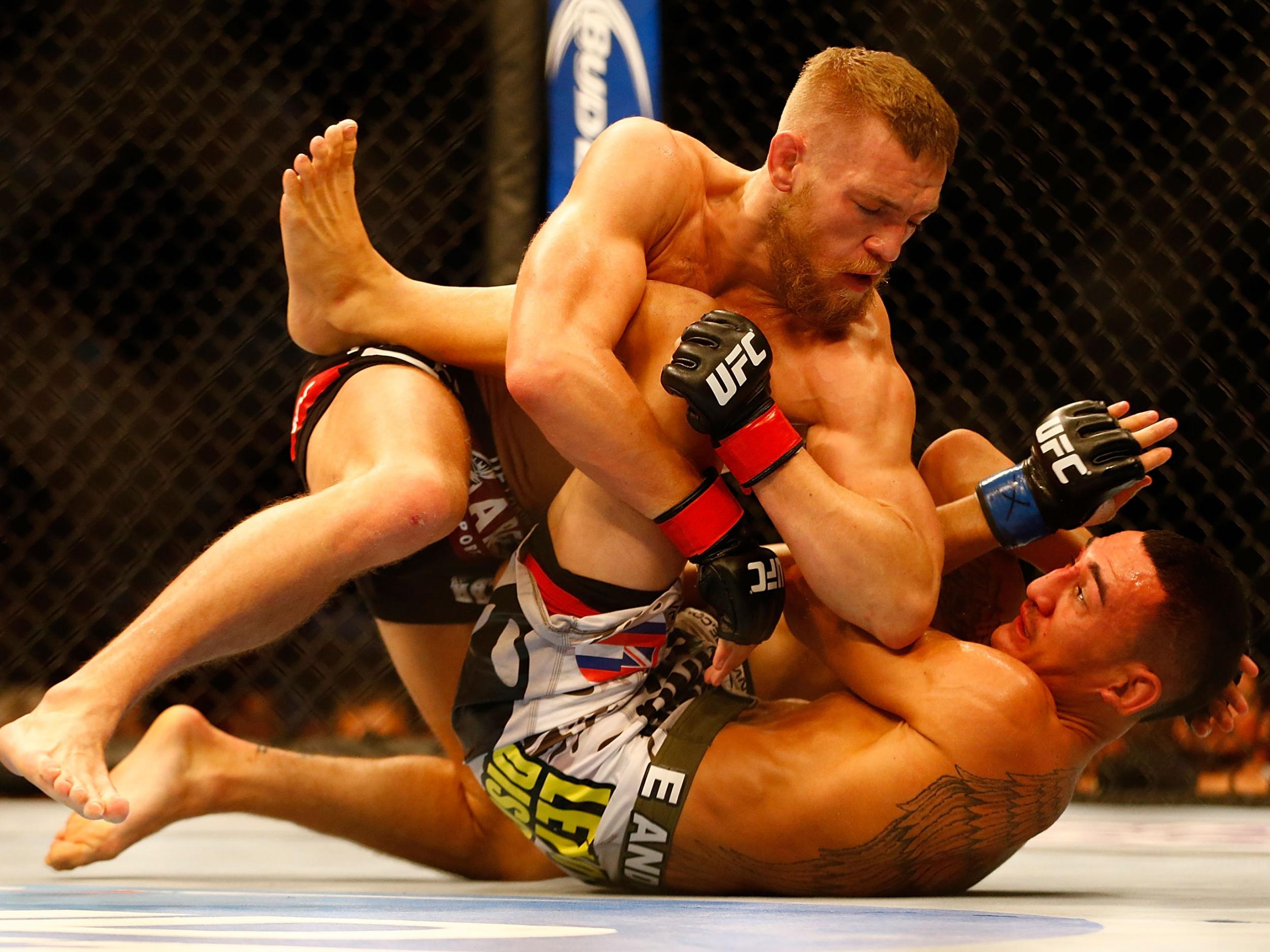 McGregor fighting Holloway at UFC Boston in August 2013