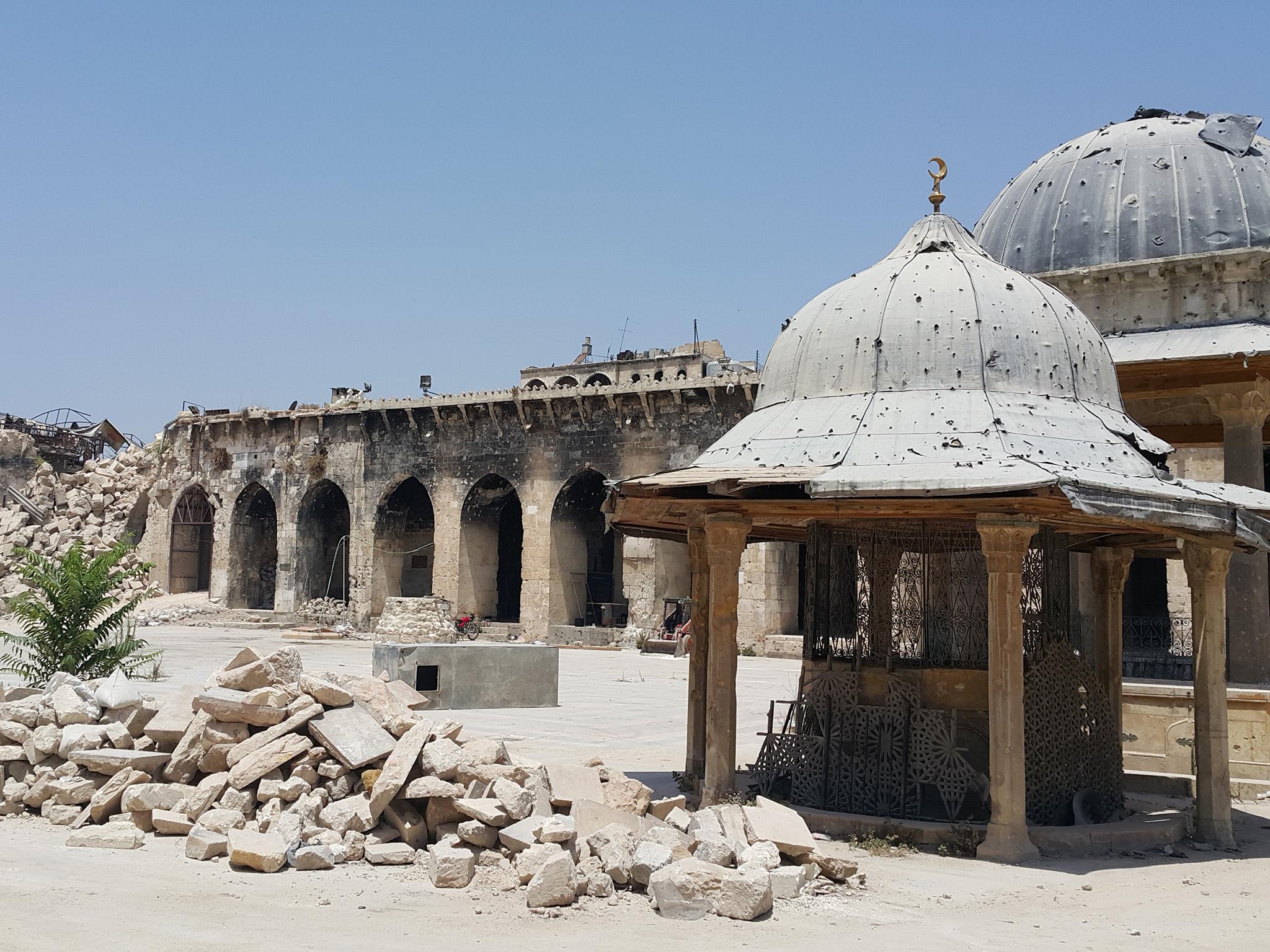 &#13;
Rubble in the courtyard of the Great Mosque with stone remains of the minaret far left (Photo: Nelofer Pazira)&#13;