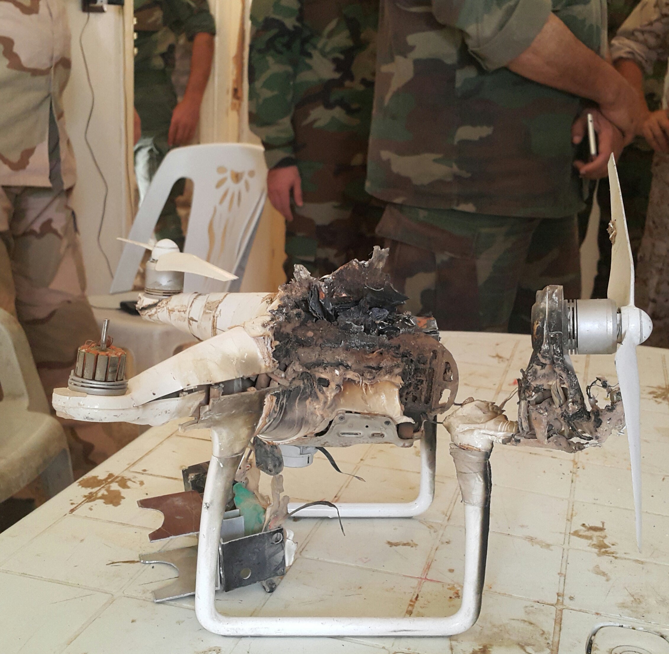 Burned-out wreck of a small Isis reconnaisance drone shot down by a Syrian soldier