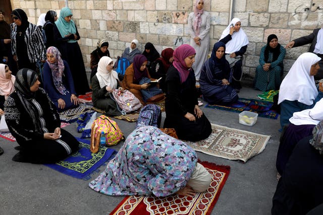 Palestinian women outside the compound known to Muslims as the Noble Sanctuary, and to Jews as Temple Mount