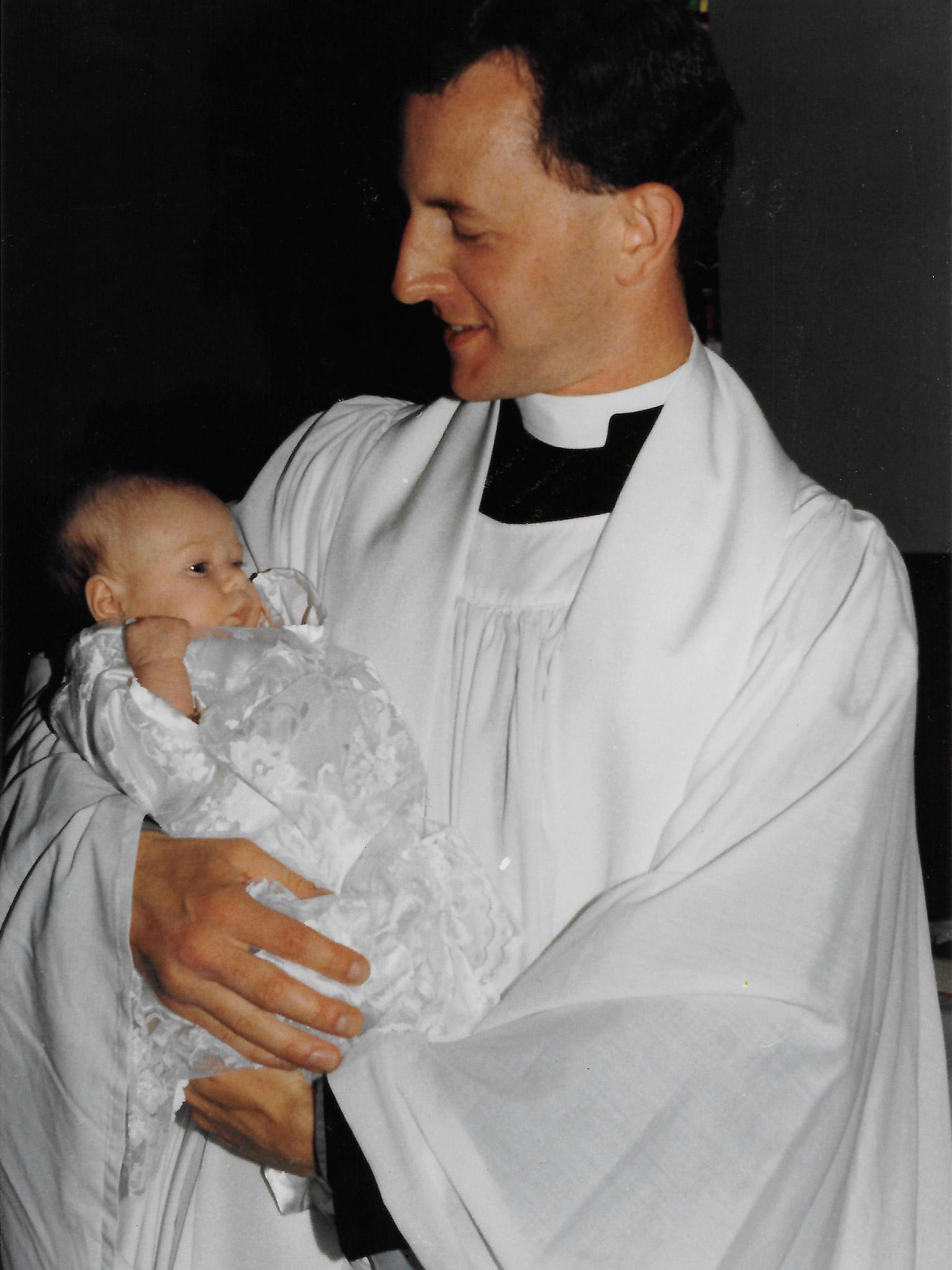 Simon baptising a baby at Dinnington church