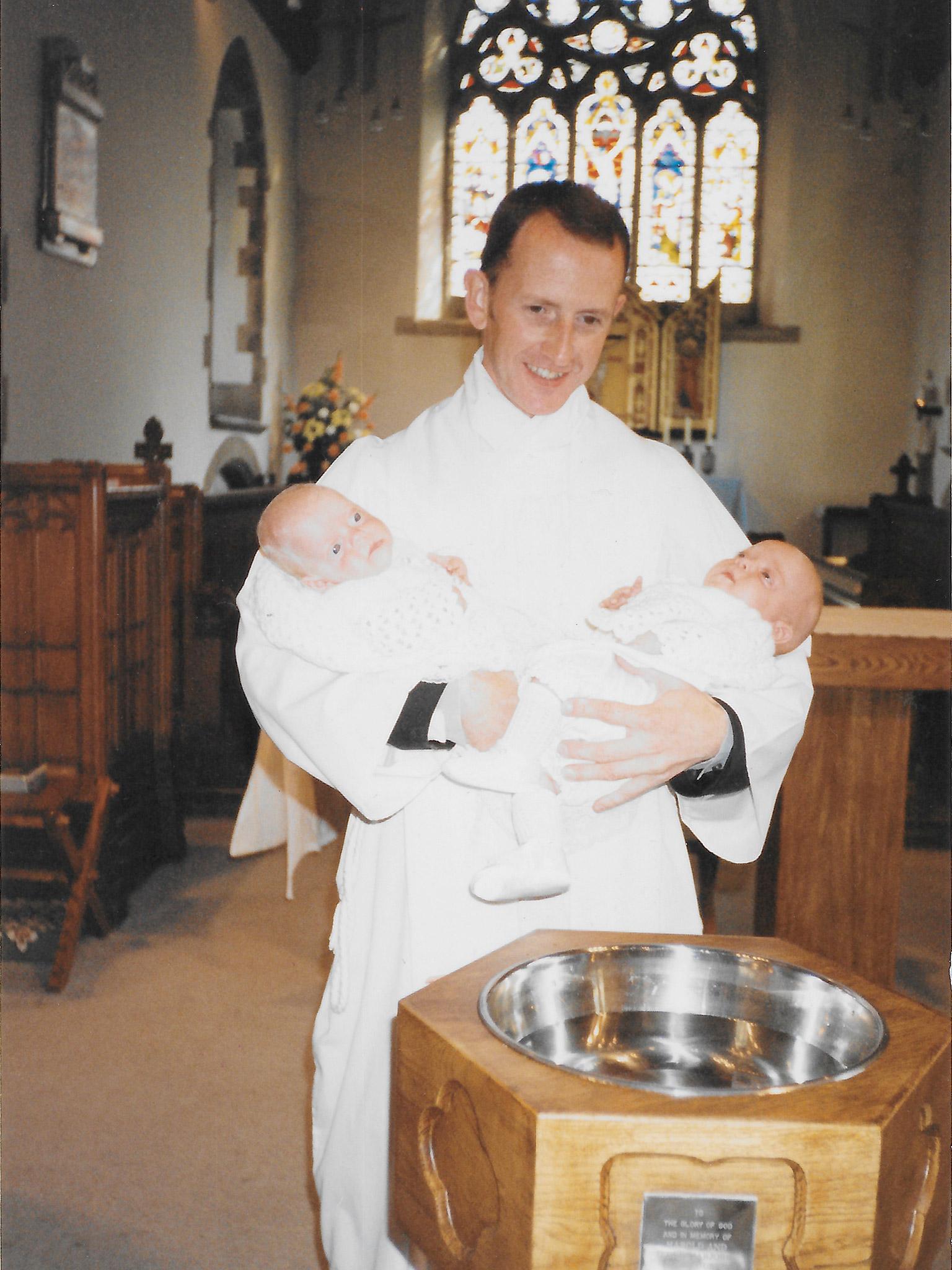 Simon baptising two babies at Dinnington Church in 1985