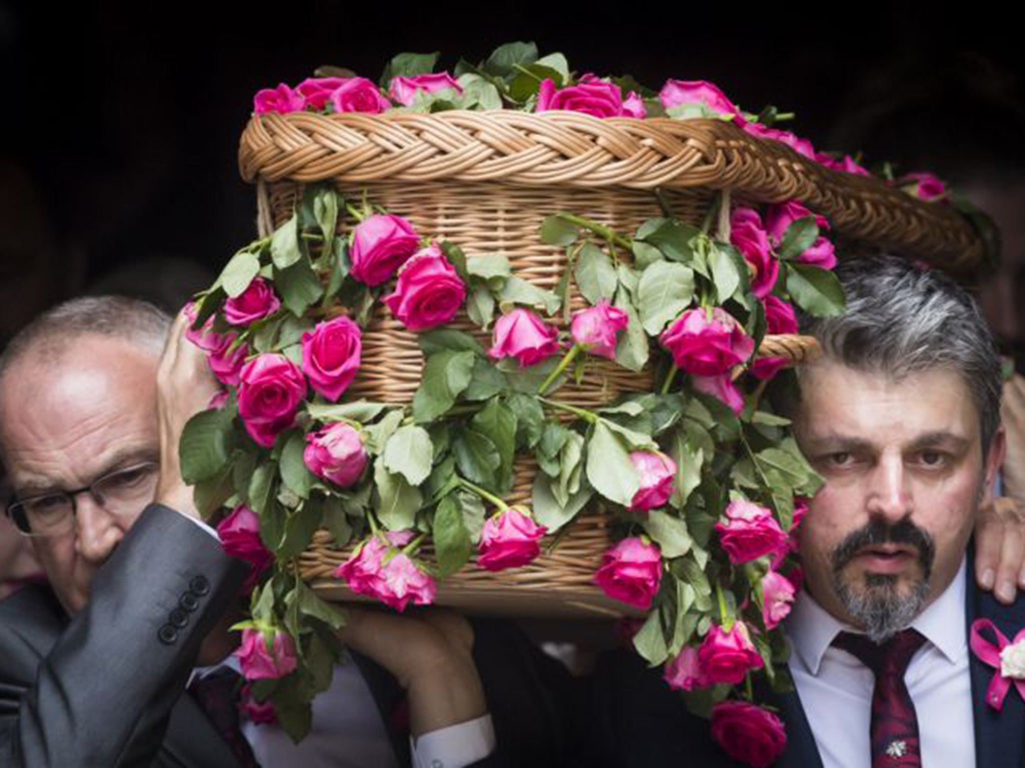 Saffie Roussos’ father Andrew (right) carries her coffin into Manchester Cathedral