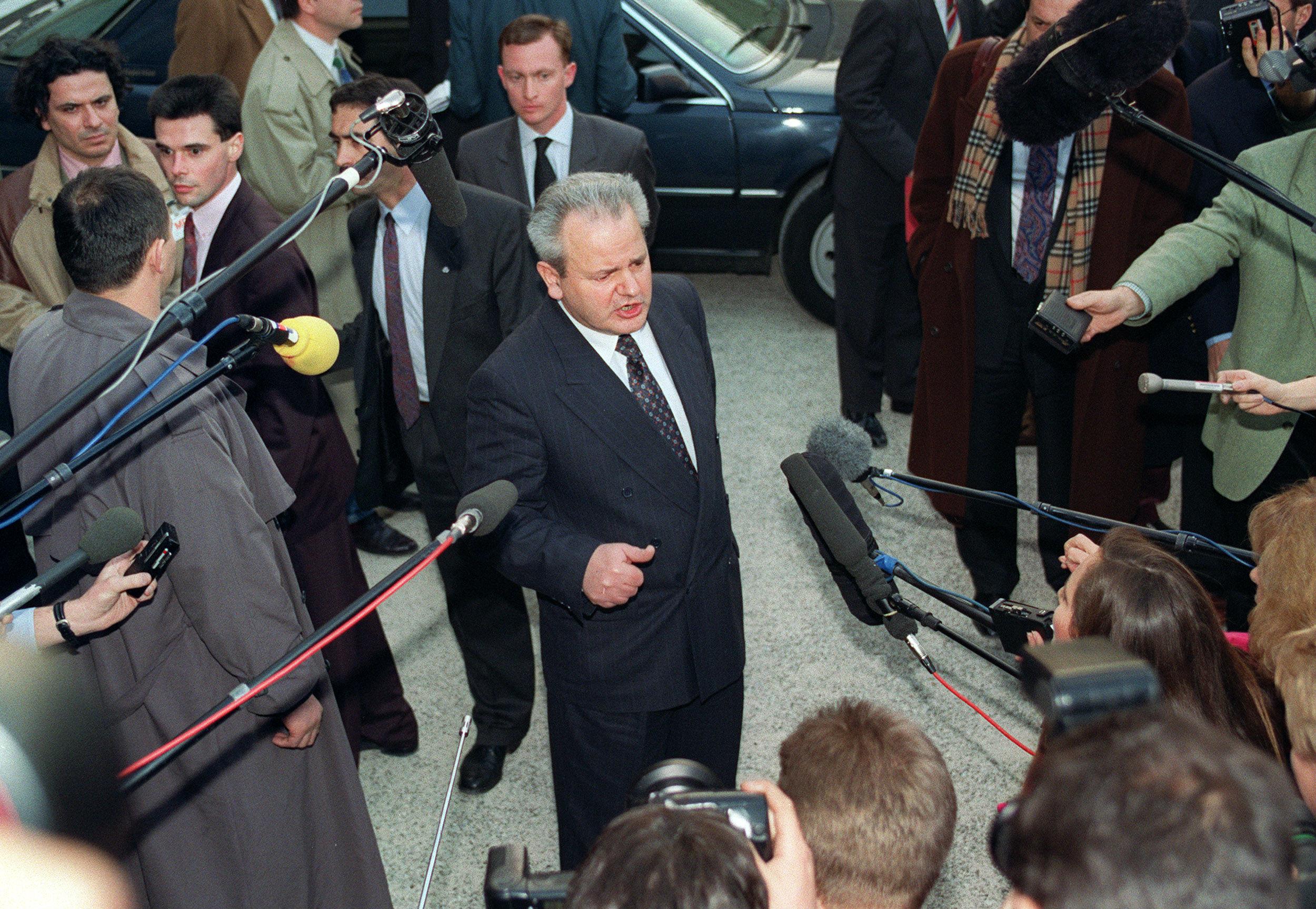 Slobodan Milosevic addresses the media in Paris in March 1993