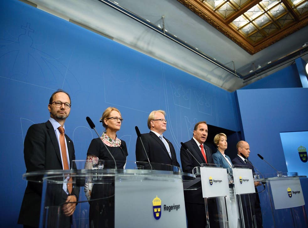 (L-R) Sweden's Minister for Infrastructure Tomas Eneroth, Minister for Migration, Helene Fritzon, Minister of Defence Peter Hultqvist, Prime minister Stefan Lofven, Minister for Social Security Annika Strandhall and Minister for Home Affairs and Justice Morgan Johansson attend a press conference at Rosenbad, the Swedish government headquarters, in Stockholm on July 27, 2017