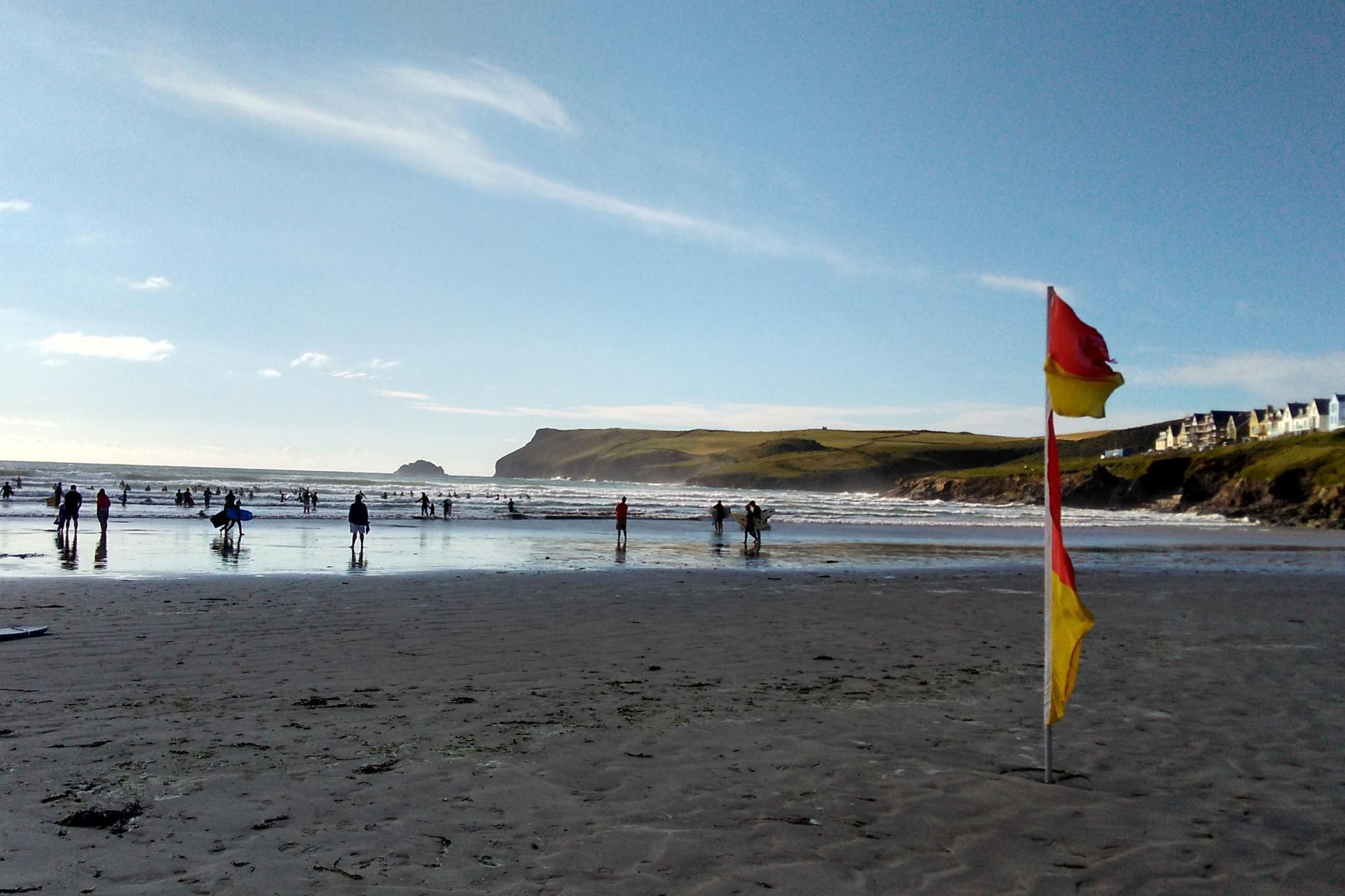 The red and yellow flags are set down each day to designate the safe area to swim in