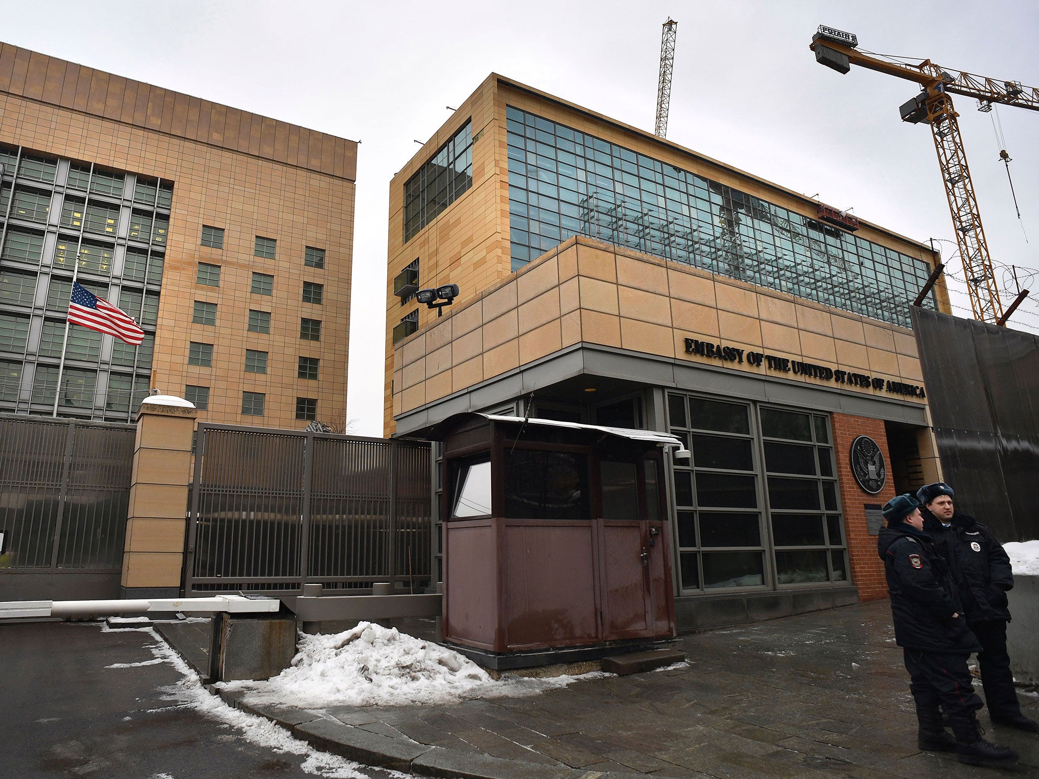 Russian policemen stand guard in front of the US Embassy in Moscow