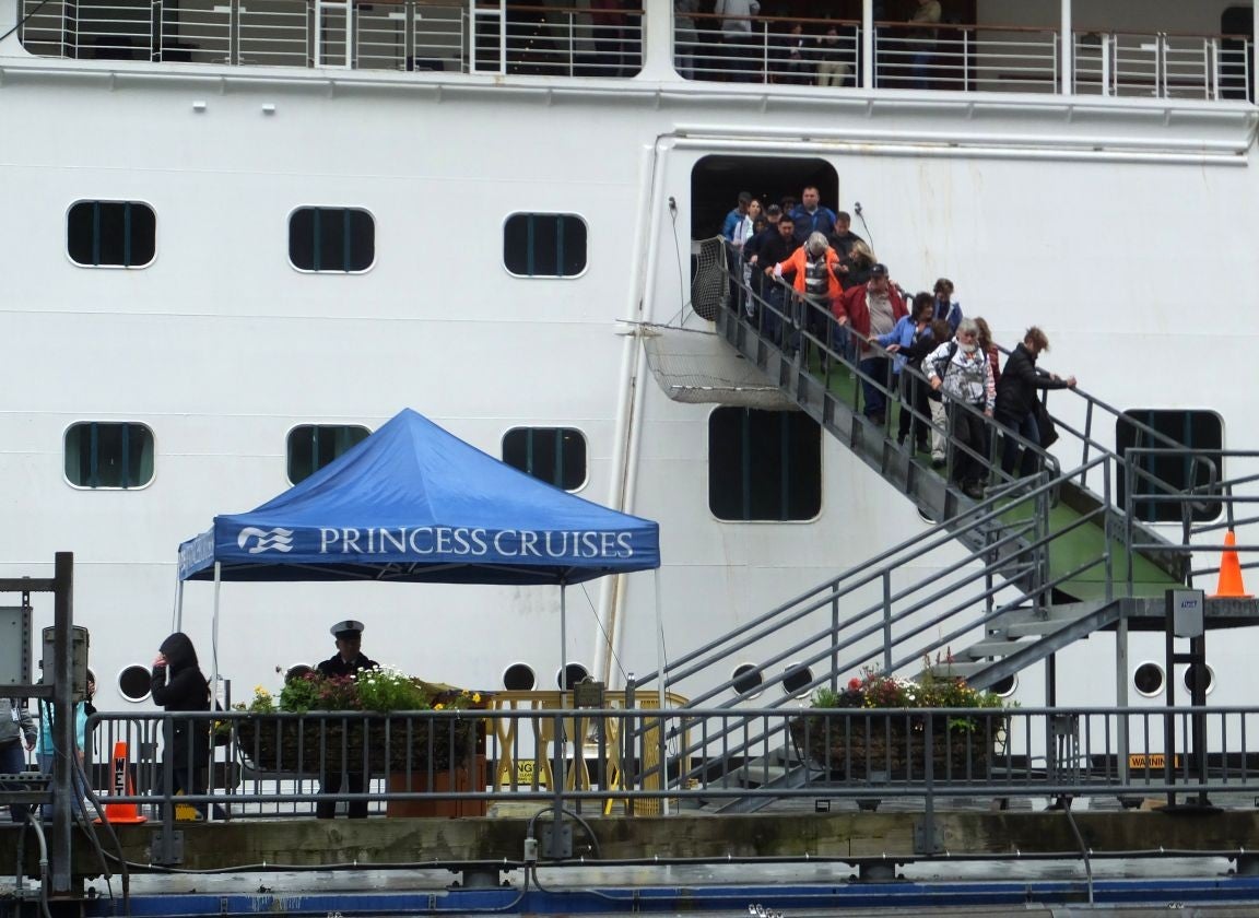 Passengers on the Emerald Princess disembark in Juneau, Alaska on Wednesday