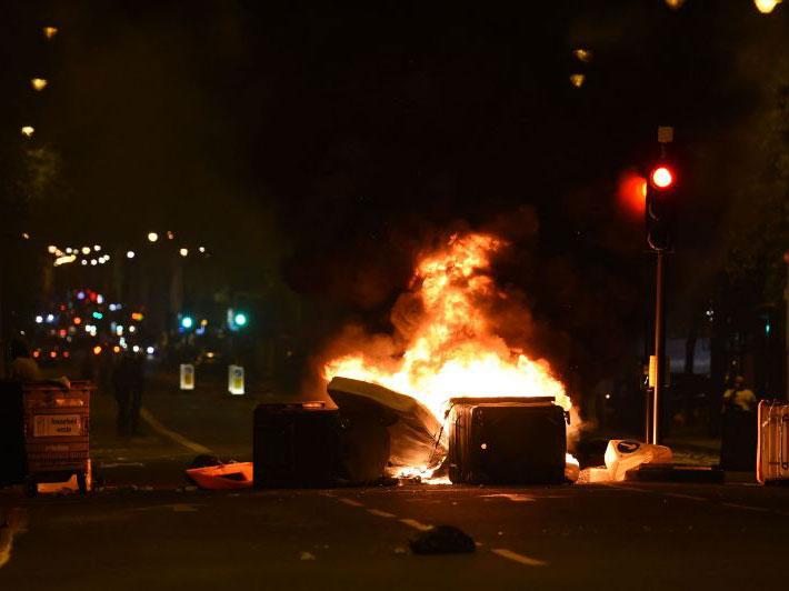 &#13;
Makeshift road blocks were set on fire during protests over Rashan Charles and Edson Da Costa's deaths in Kingsland Road &#13;