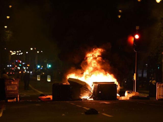 Makeshift road blocks were set on fire during protests in Kingsland Road