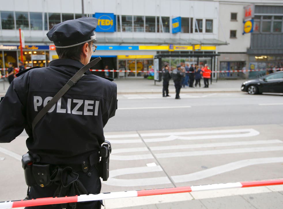 A police officer at the scene of the attack where one man was killed