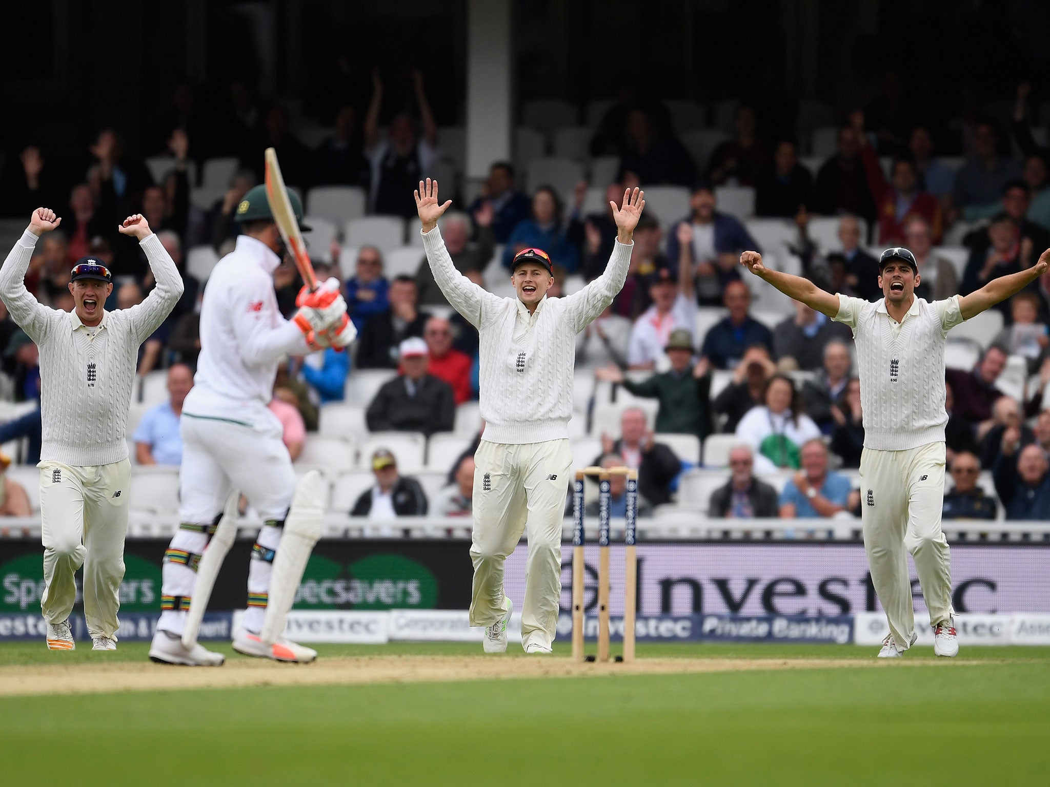 England celebrate taking the wicket of Heino Kuhn on day three