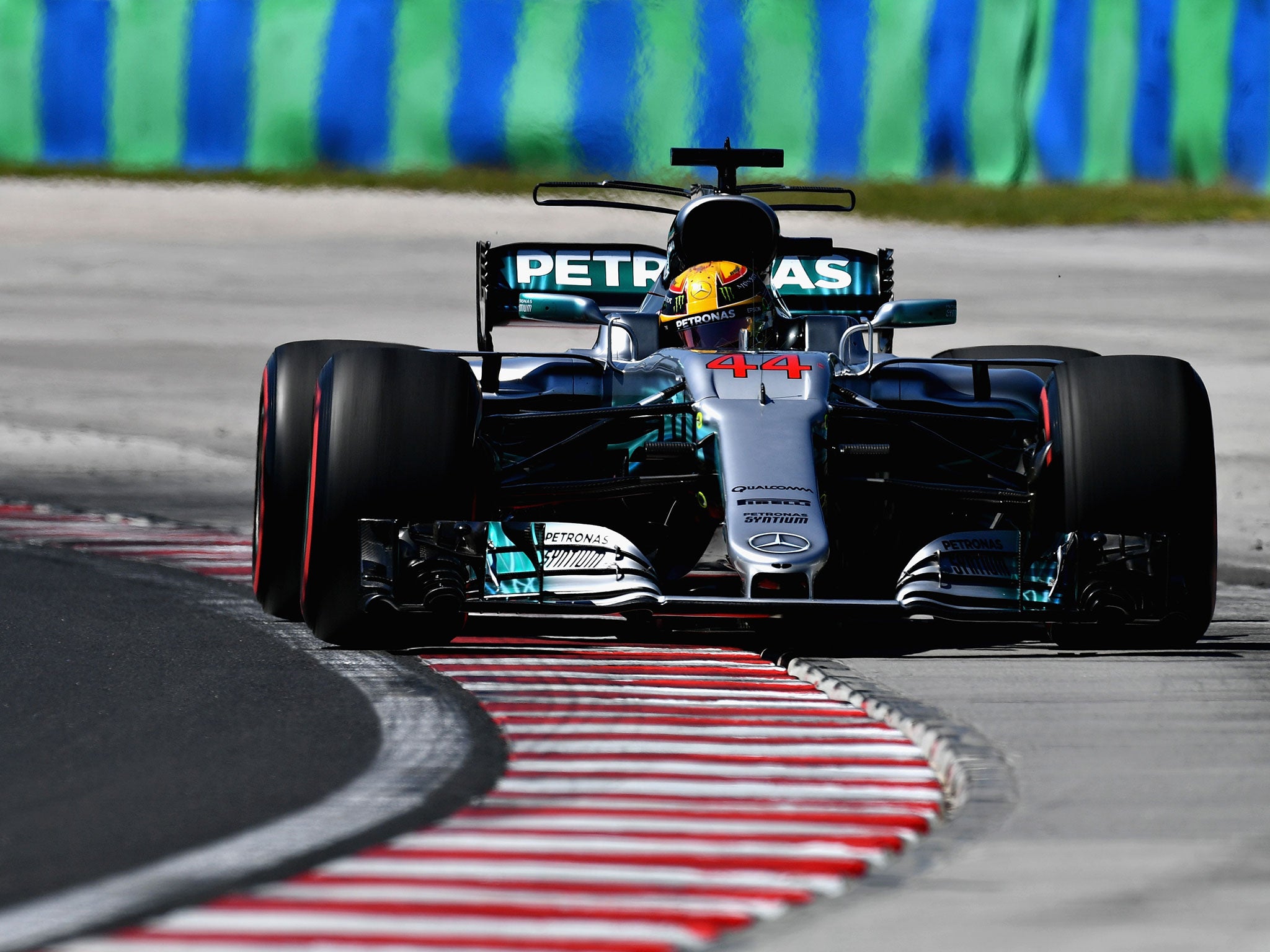 Lewis Hamilton runs wide on the exit of turn five