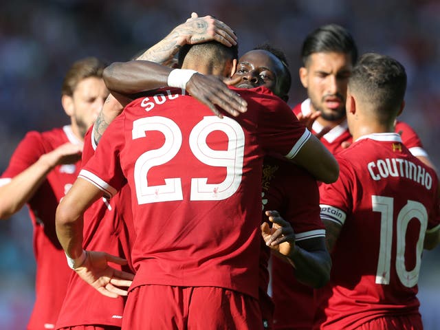 Sadio Mane and Dominic Solanke celebrate the latter's opening goal against Hertha Berlin