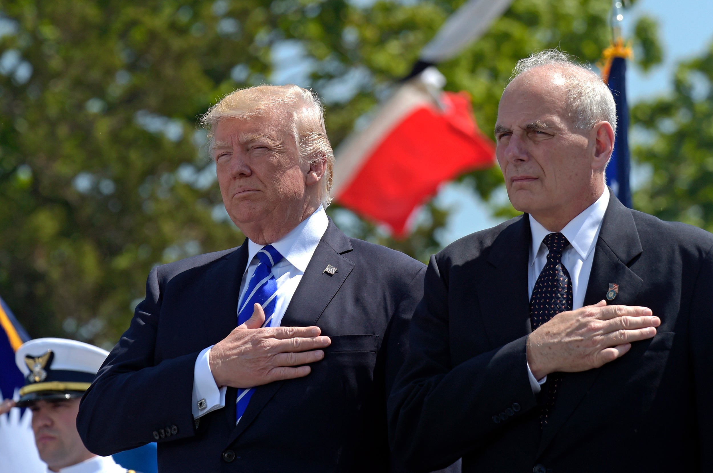 The President and then Homeland Security Secretary listen to the national anthem in May