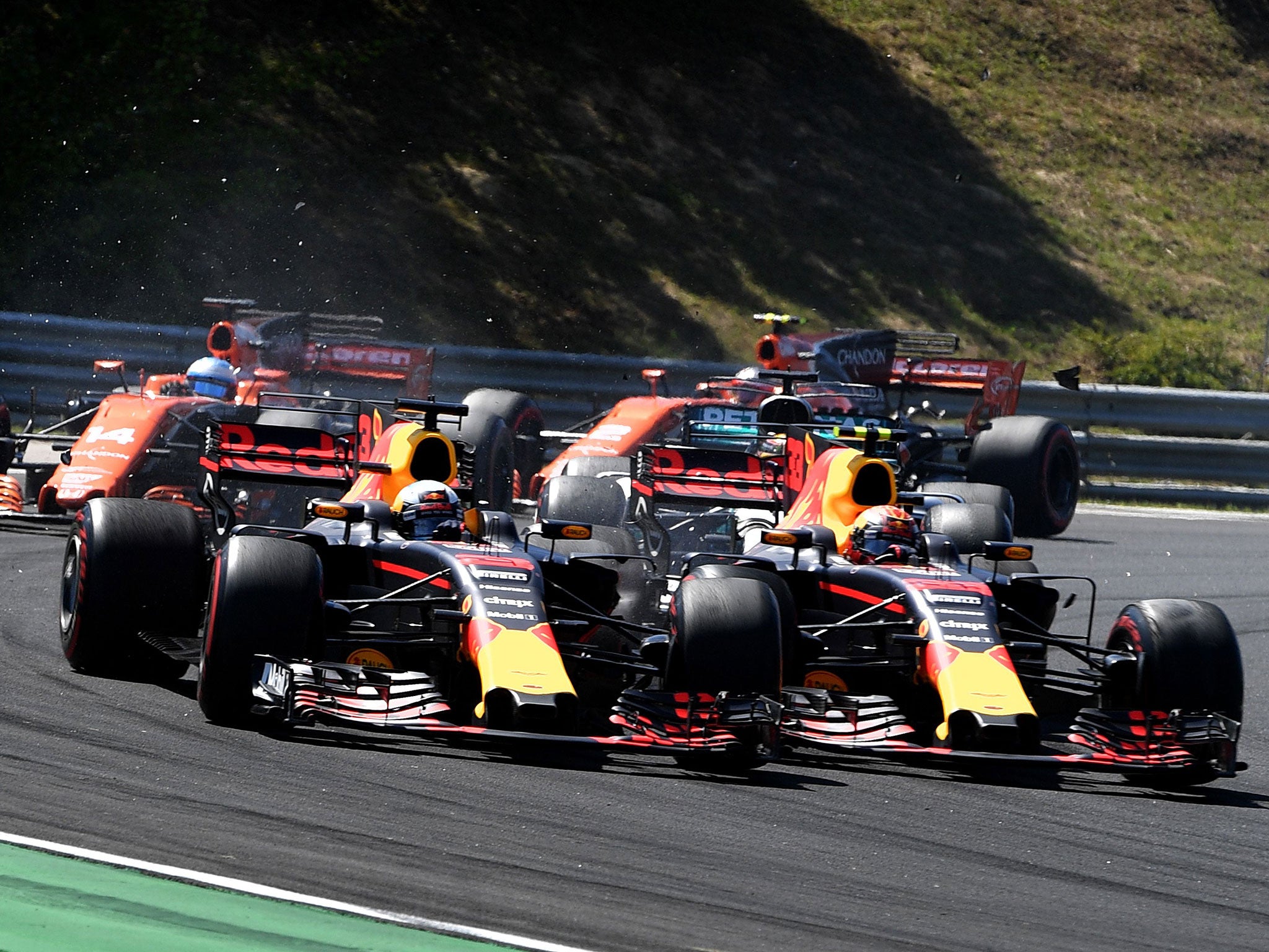 Max Verstappen slides into Daniel Ricciardo to take his Red Bull teammate out of the race