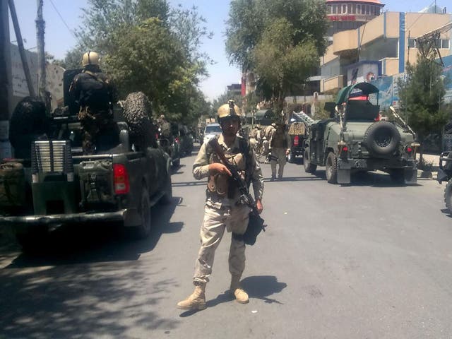 Afghan security forces arrive at the site of an explosion near the Iraqi embassy in Kabul