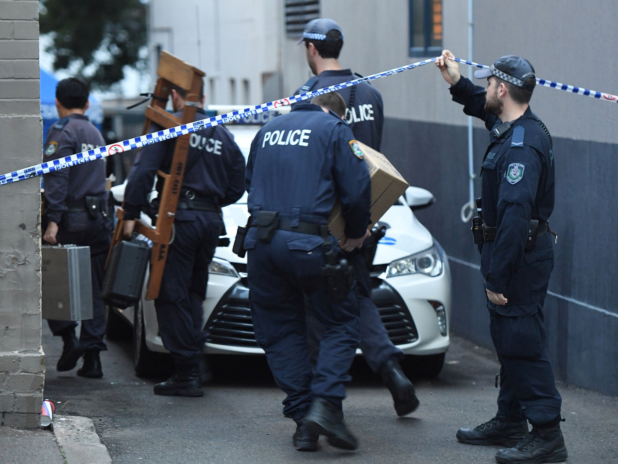Police probing the alleged plot to target an airliner raid a property in the Sydney suburb of Surry Hills